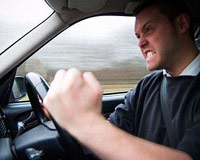 Guy yelling inside his car