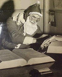 Santa reviews case law books in his library