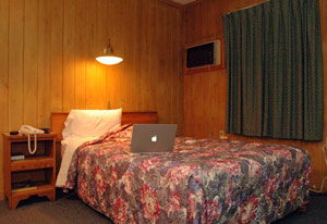 Seedy motel room made of wood