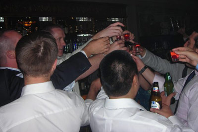 KC and friends all taking shots at the bar