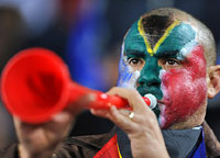 Guy blowing a vuvuzela in South Africa World Cup 2010