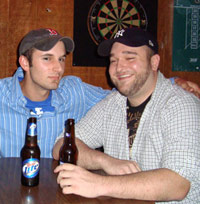 Two guys in a sports bar having beers