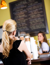 Woman trying to decide what to order at Starbucks