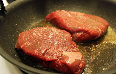 Searing steak in a pan