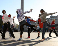 Black girls doing a hip hop dance outside