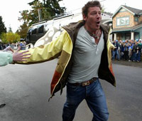 Ty Pennington running down the street on Extreme Home Makeover