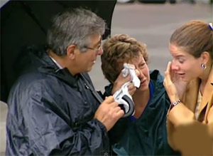 Woman poked in the eye by an umbrella