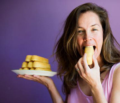 Woman eating a Twinkie