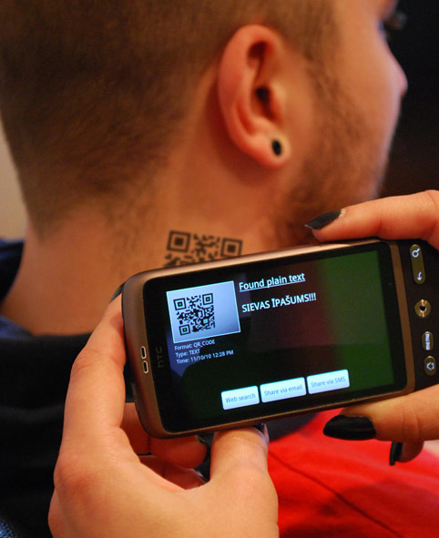 QR code tattoo on back of neck