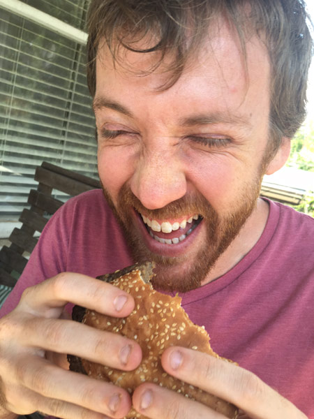 Court Sullivan eating a Big AZ burger