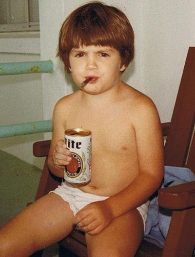 Boy smoking a cigarette and drinking a Miller Lite