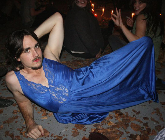 Cole cross-dressing in a blue dress