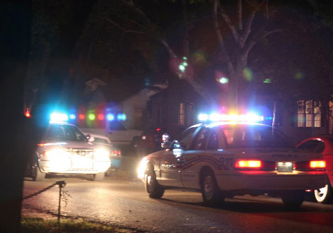 Cop cars with officers arresting people