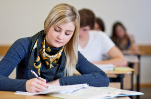 Female student writing in class