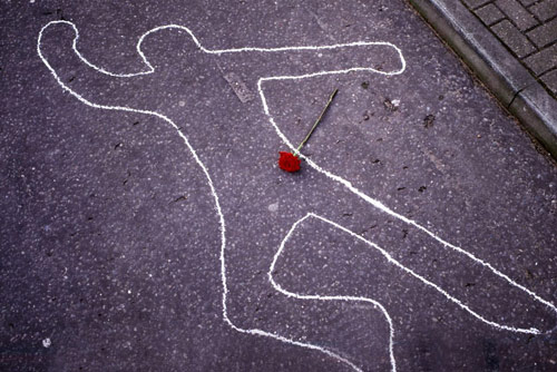 Chalk on the sidewalk marking off a homocide scene
