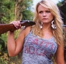 Miranda Lambert holding a shotgun