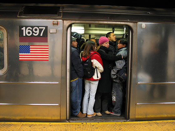 NYC packed subway train with doors open