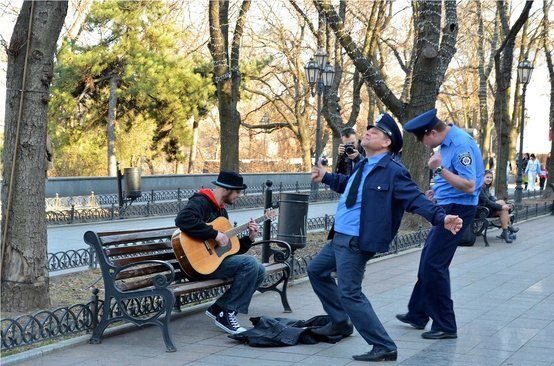 Cop dancing in the sidewalk