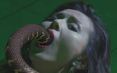 Snake going into a woman's mouth