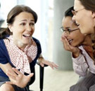 Three women having a vapid conversation in public