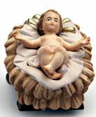 Baby Jesus statue in a crib