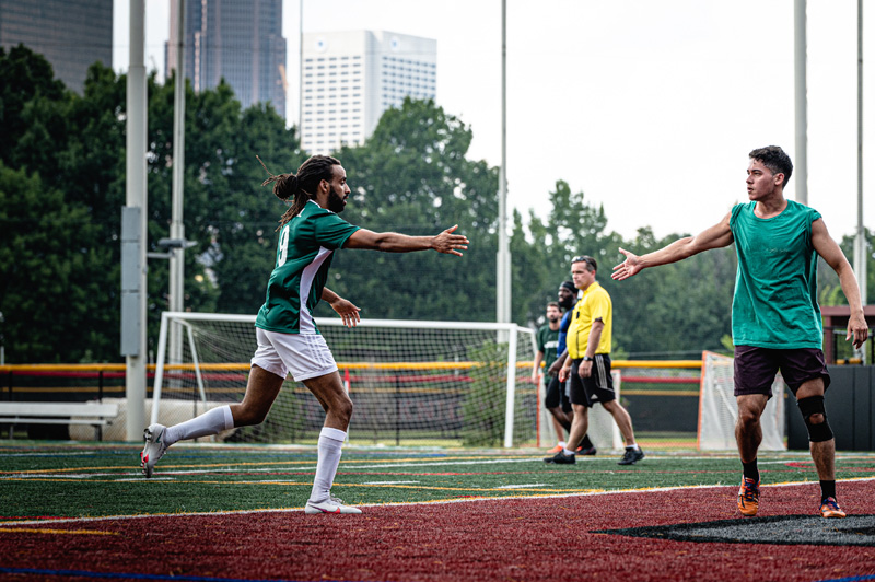 SOPFC league players showing good sportsmanship near referee