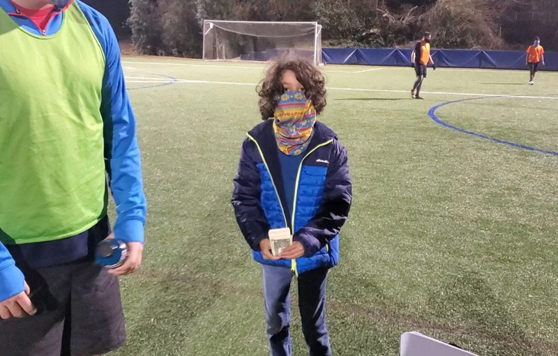 Eli making his first sale at the soccer field