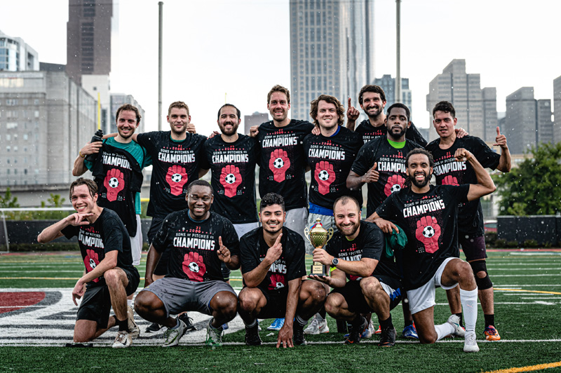 SOPFC team posing as league champions on the pitch