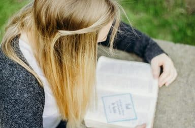 My first girlfriend with blonde hair reading a note