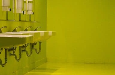 Public bathroom sinks by the stalls