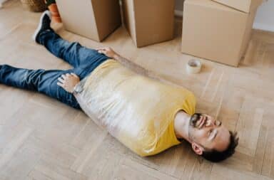 Man wrapped up lying on the floor