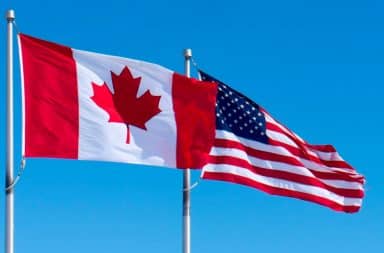 Canadian flag in front of American flag