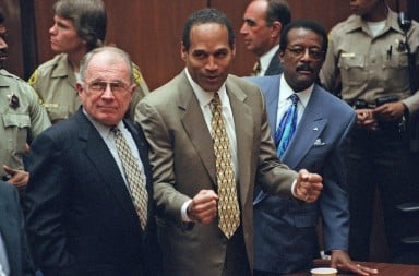 OJ fist pump cheers after the not guilty verdict in the courtroom
