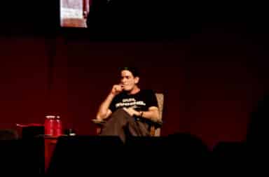Charlie Sheen on stage in DUH WINING tshirt