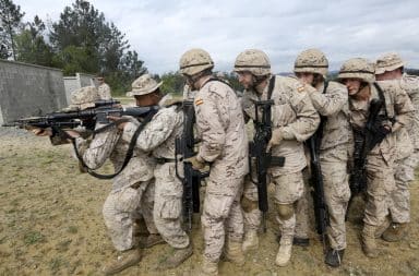 Infantry marines lined up with rifles drawn