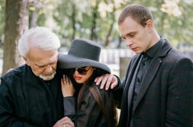 Consoling parents at a funeral