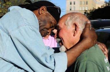 Homeless man celebrating