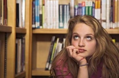 Woman rolls eyes in the library