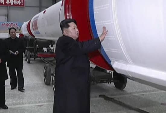 Kim Jong Un with a rocket