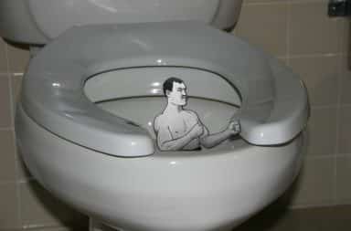 Toilet seat with a muscle manly man inside