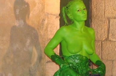 Woman covered in green goo and green body paint