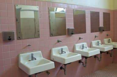 Pink public bathroom in a school
