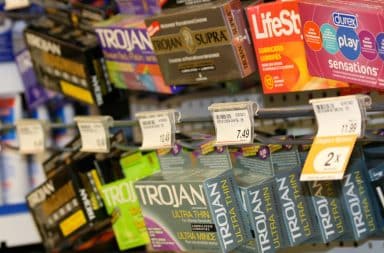 Condoms for sale on a rack in store