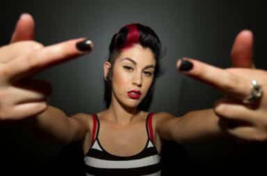 Feminist woman giving two middle fingers