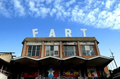 Fart sign on top of a building