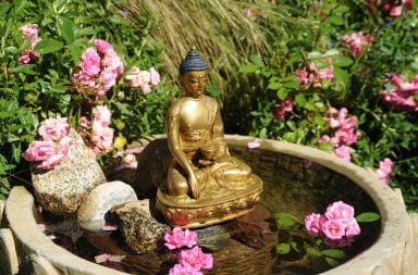 Golden Buddha statue in garden