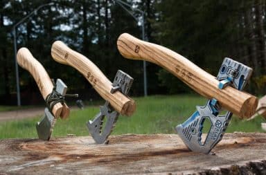 Three hatchets in a tree log