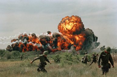 Napalm explosions in a forest during the Vietnam War