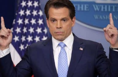 Anthony Scaramucci with his fingers pointed up at White House podium