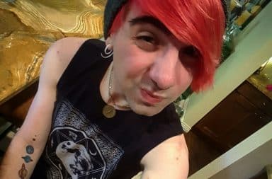 Boy in Hot Topic clothes with pink hair